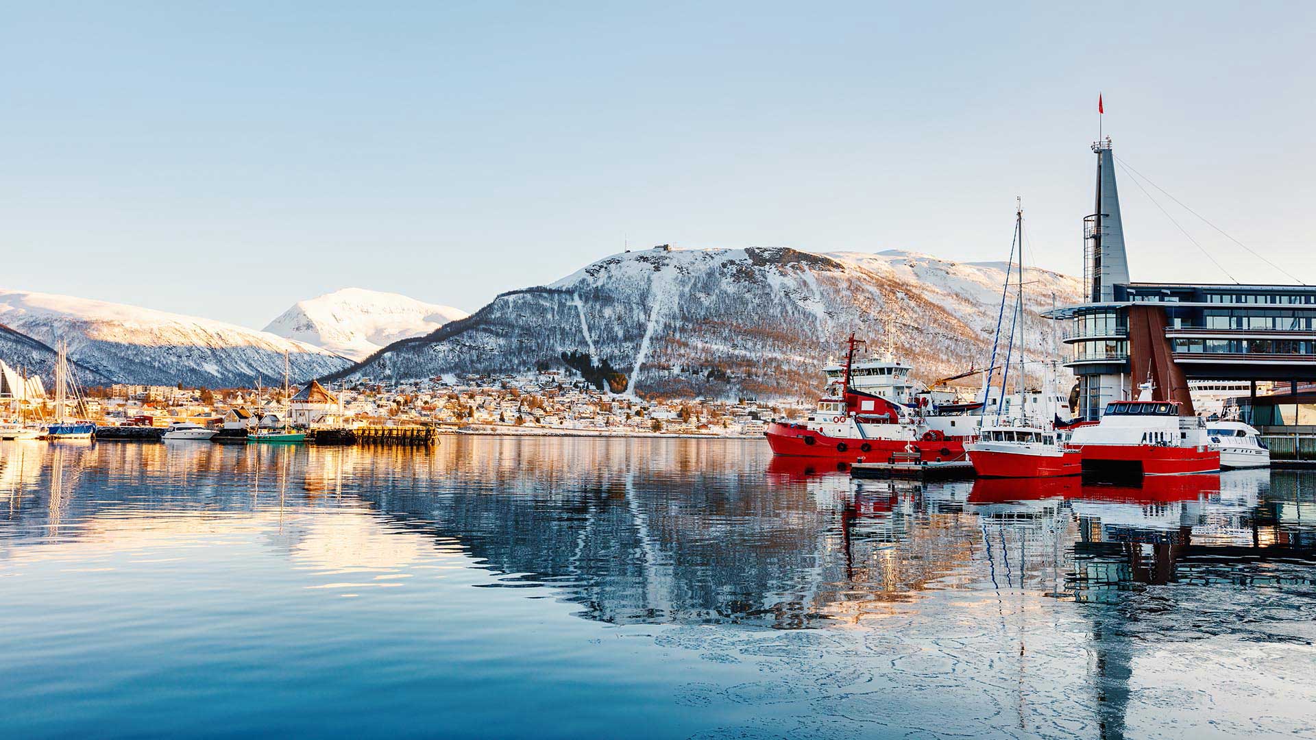 harbour of tromso under the snow