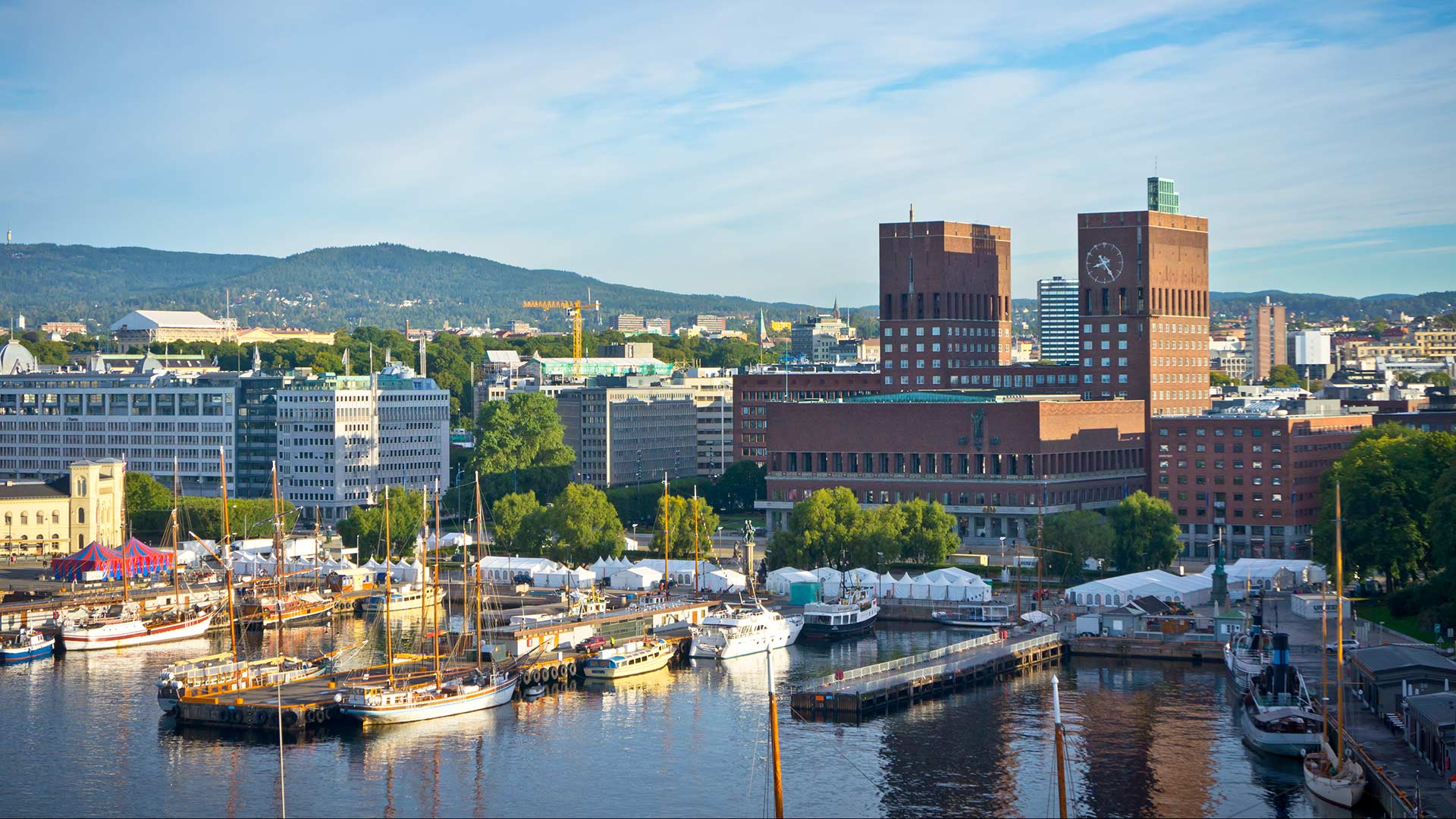 Oslo town hall and nearby harbour with boats