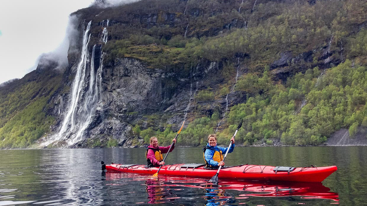 kayaking couple on fjord