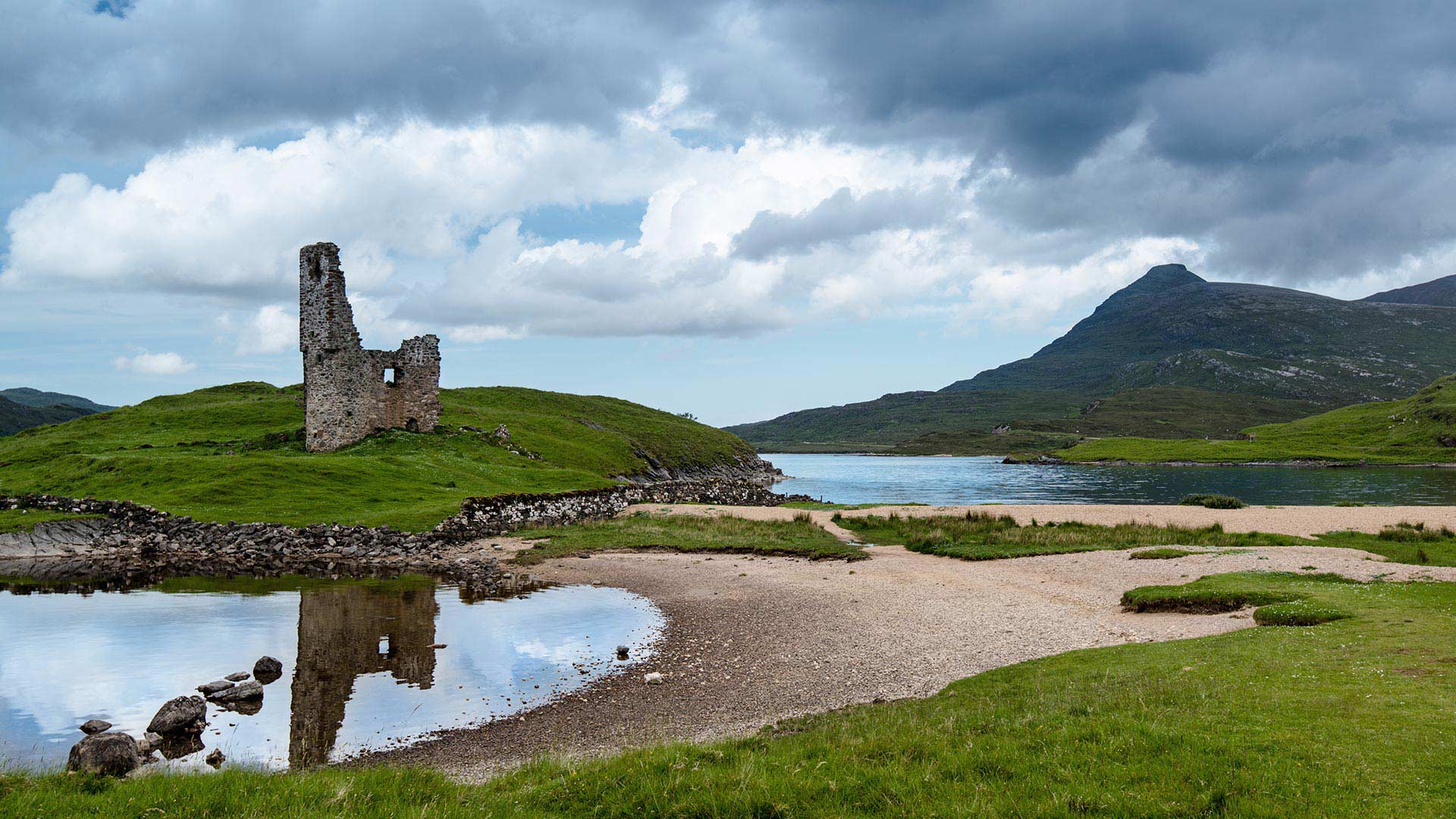 ardvreck castle ruins reflecting in the water
