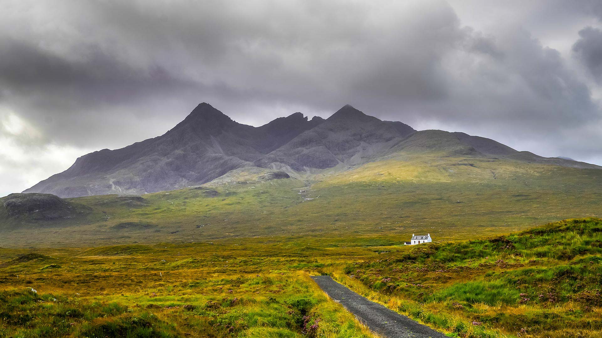 view of cottage and cuillin hills