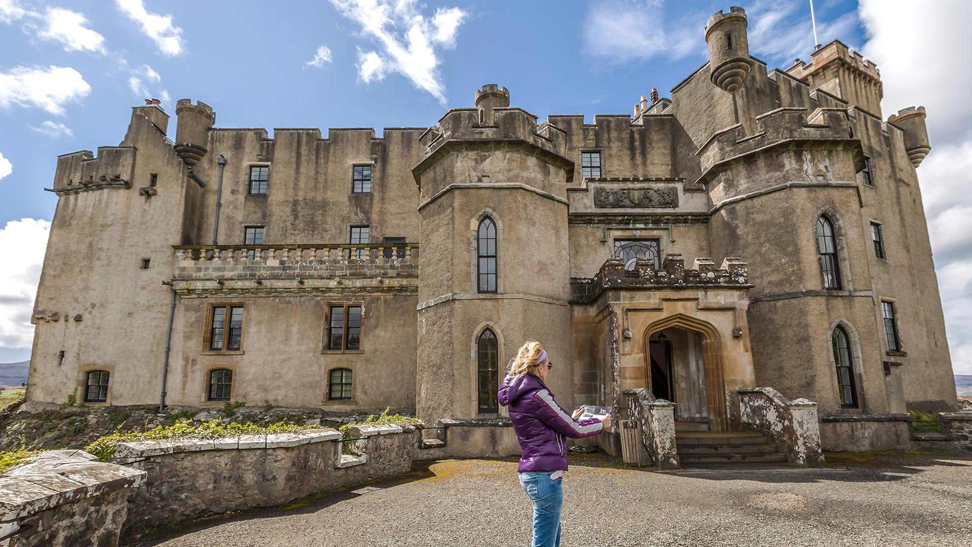 woman standing by dunvegan castle