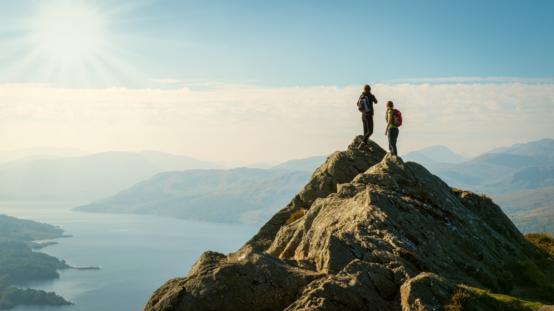 Hikers on Ben A'an, overlooking Loch Katrine, Scotland