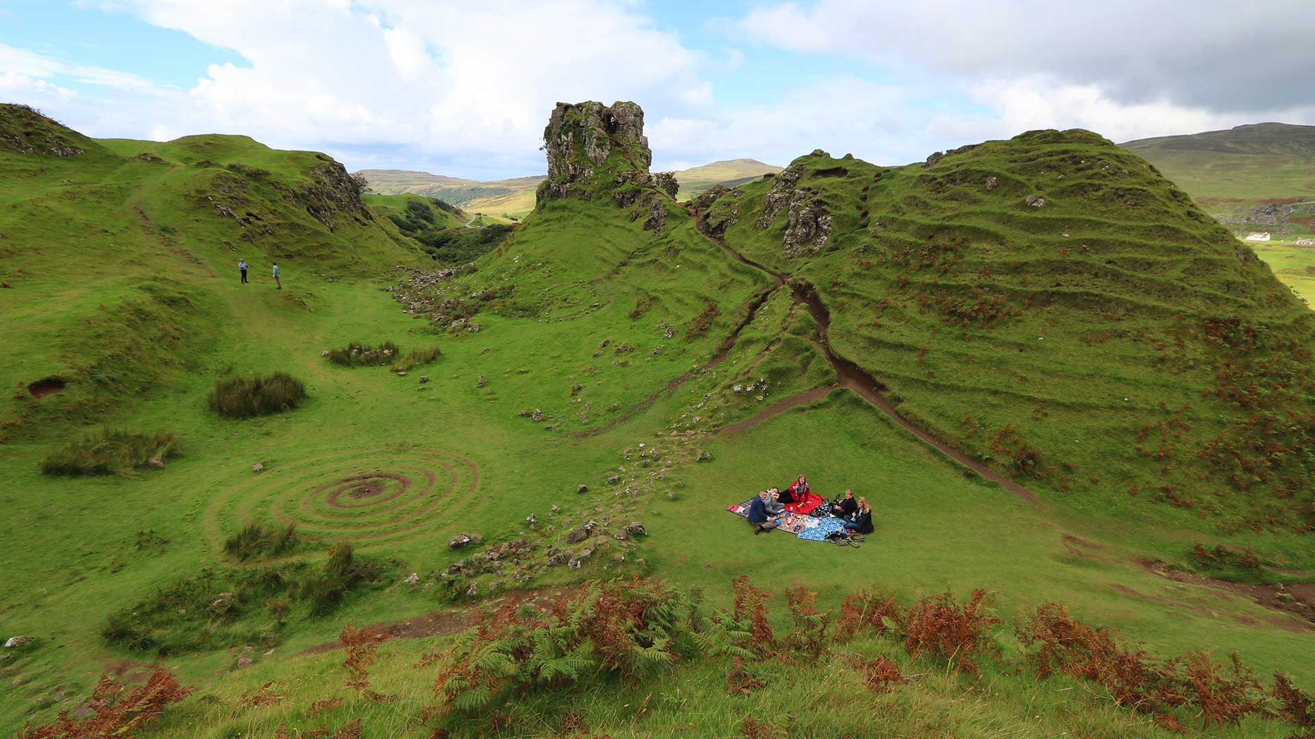 group having picnic at fairy glen, scotland