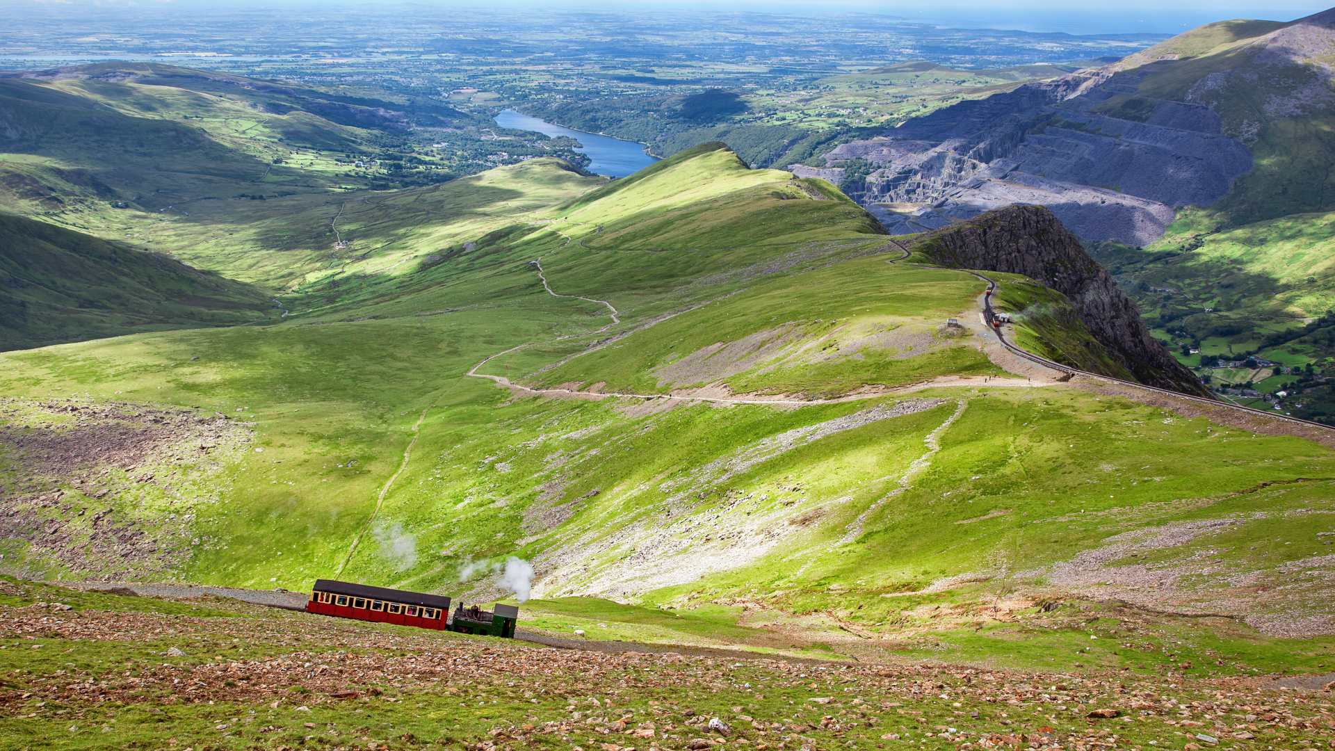 Steam train climbing Mount Snowdon from Llanberis in Eryri (Snowdonia) National Park