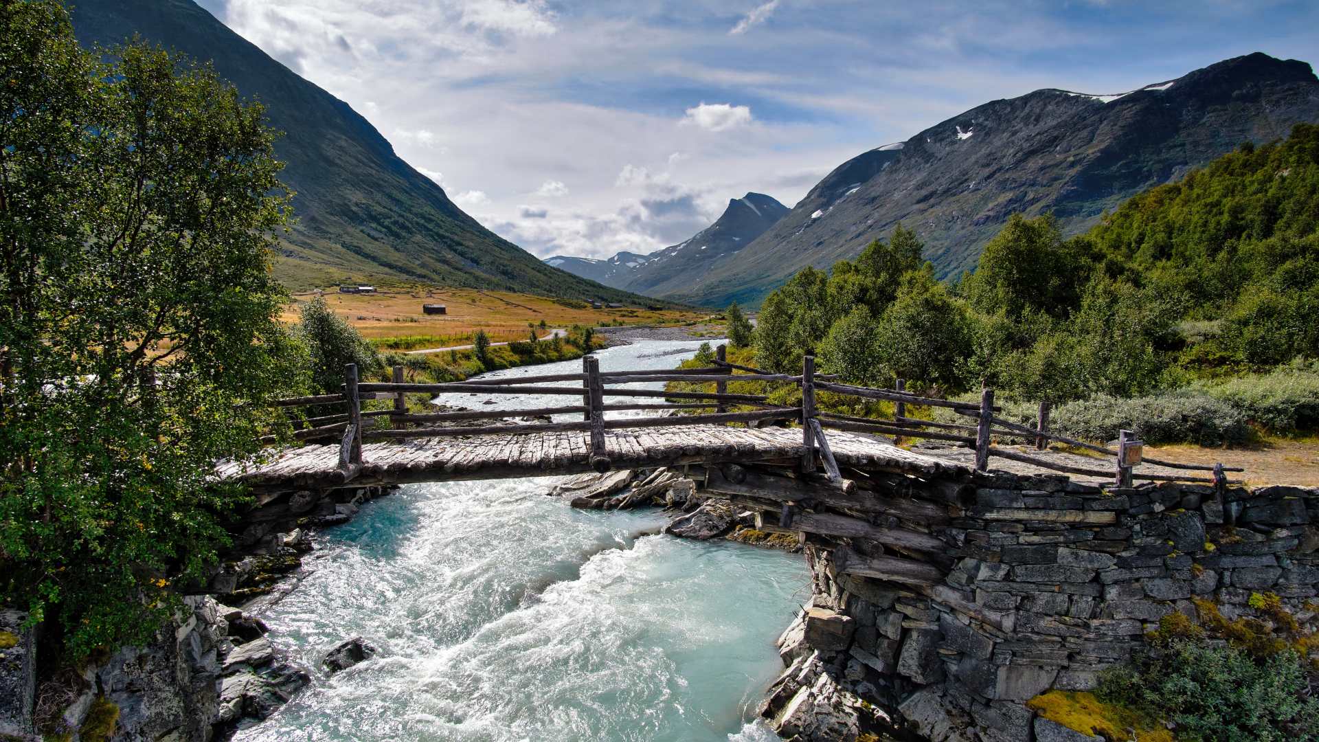 Historic stone bridge crossing a mountain river