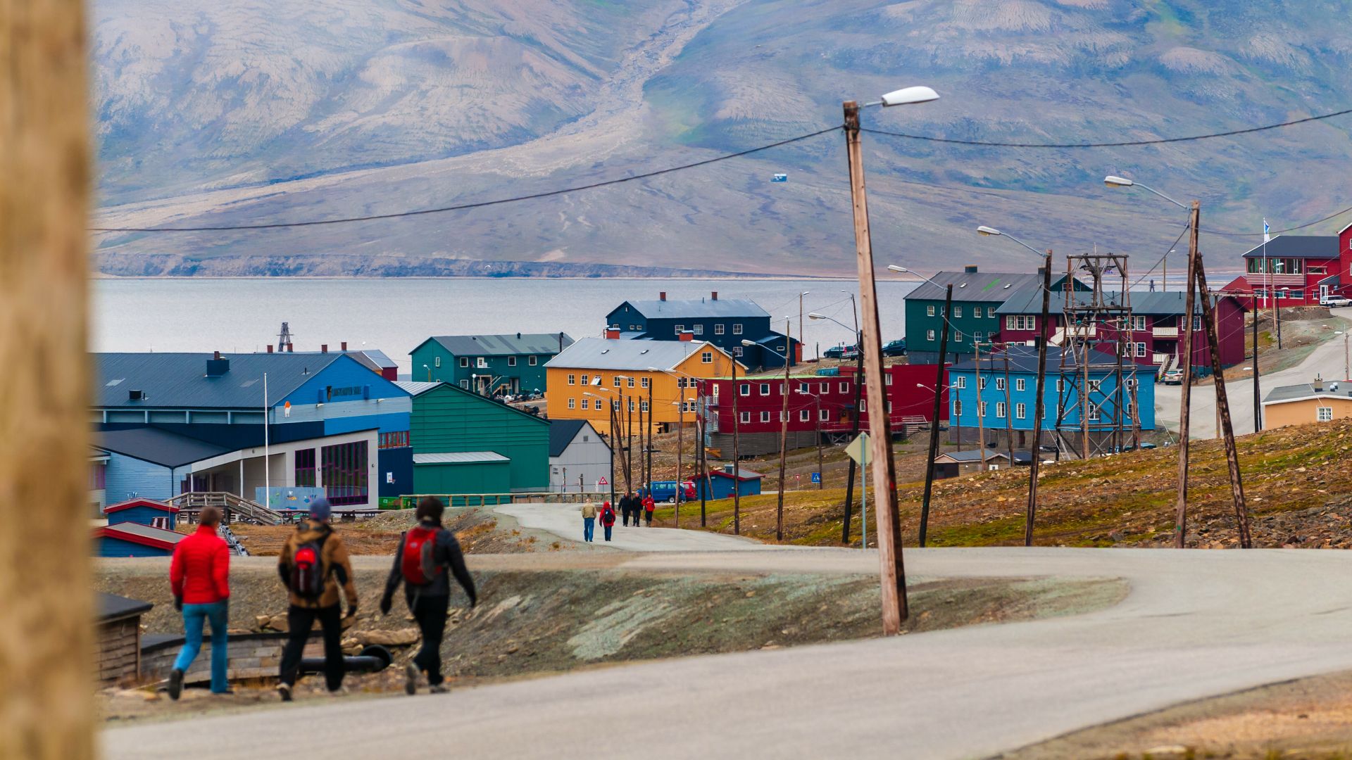 People walking down a street in Longyearbyen during summer