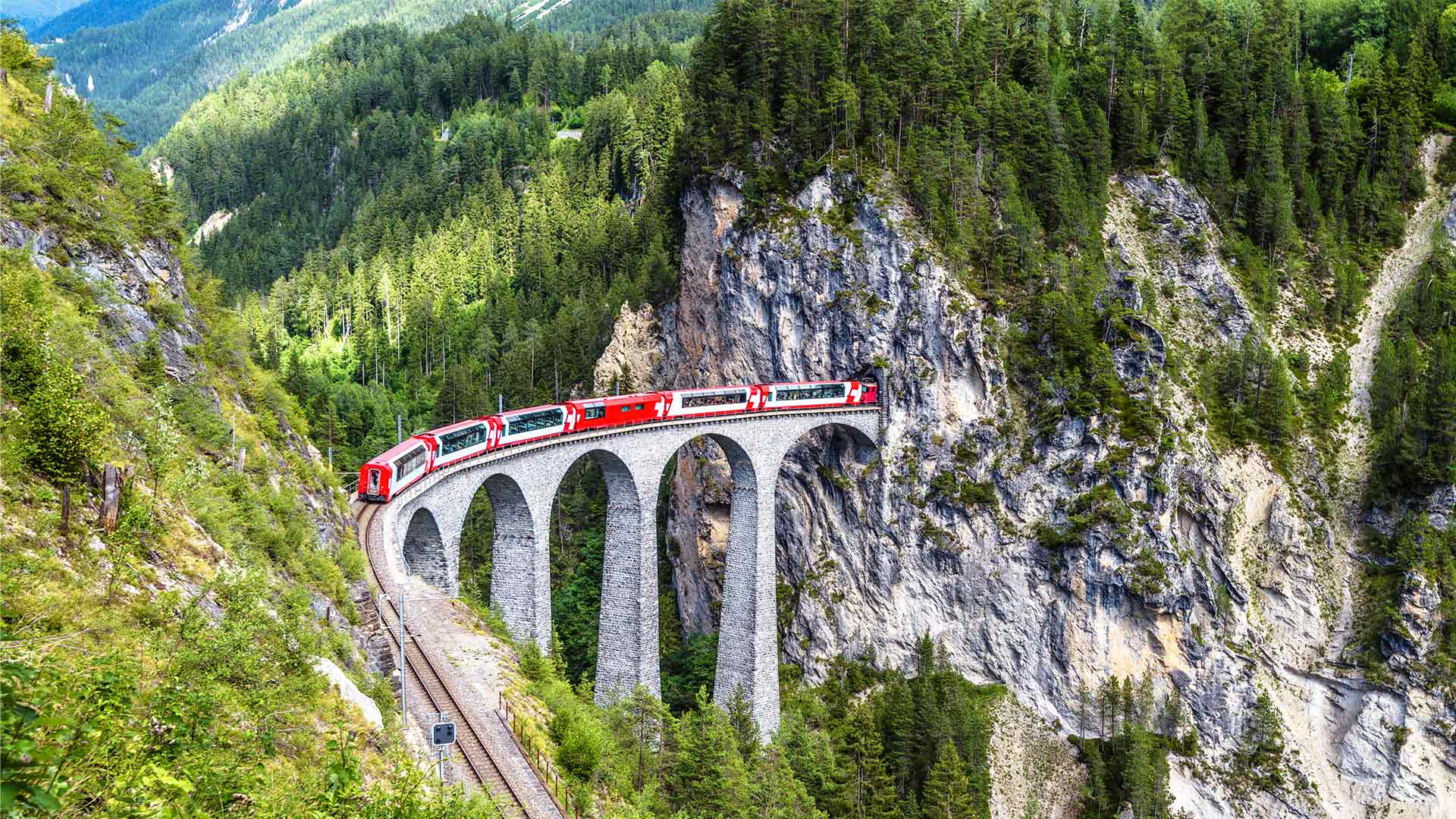he Glacier Express crossing the Landwasser Viaduct in Switzerland
