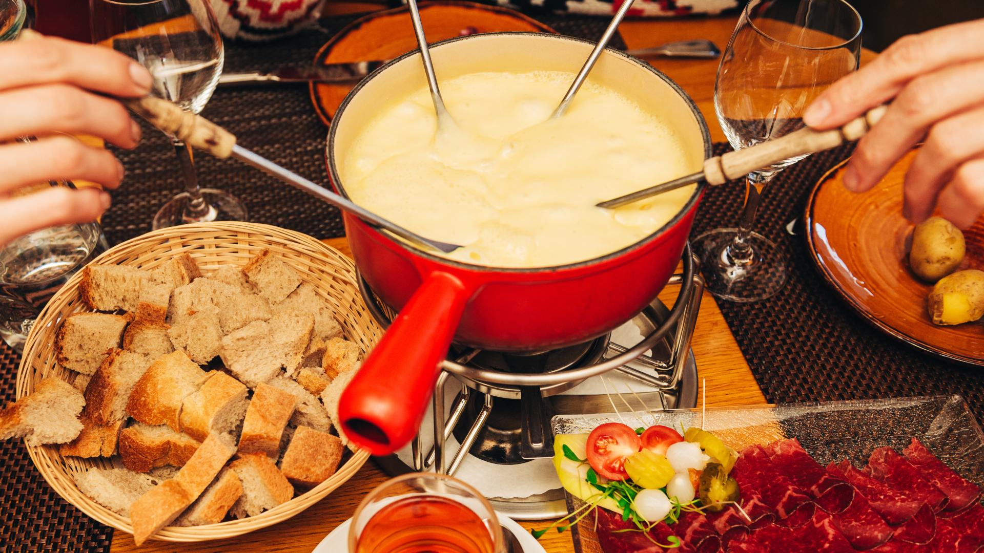 People eating fondue in the Alps