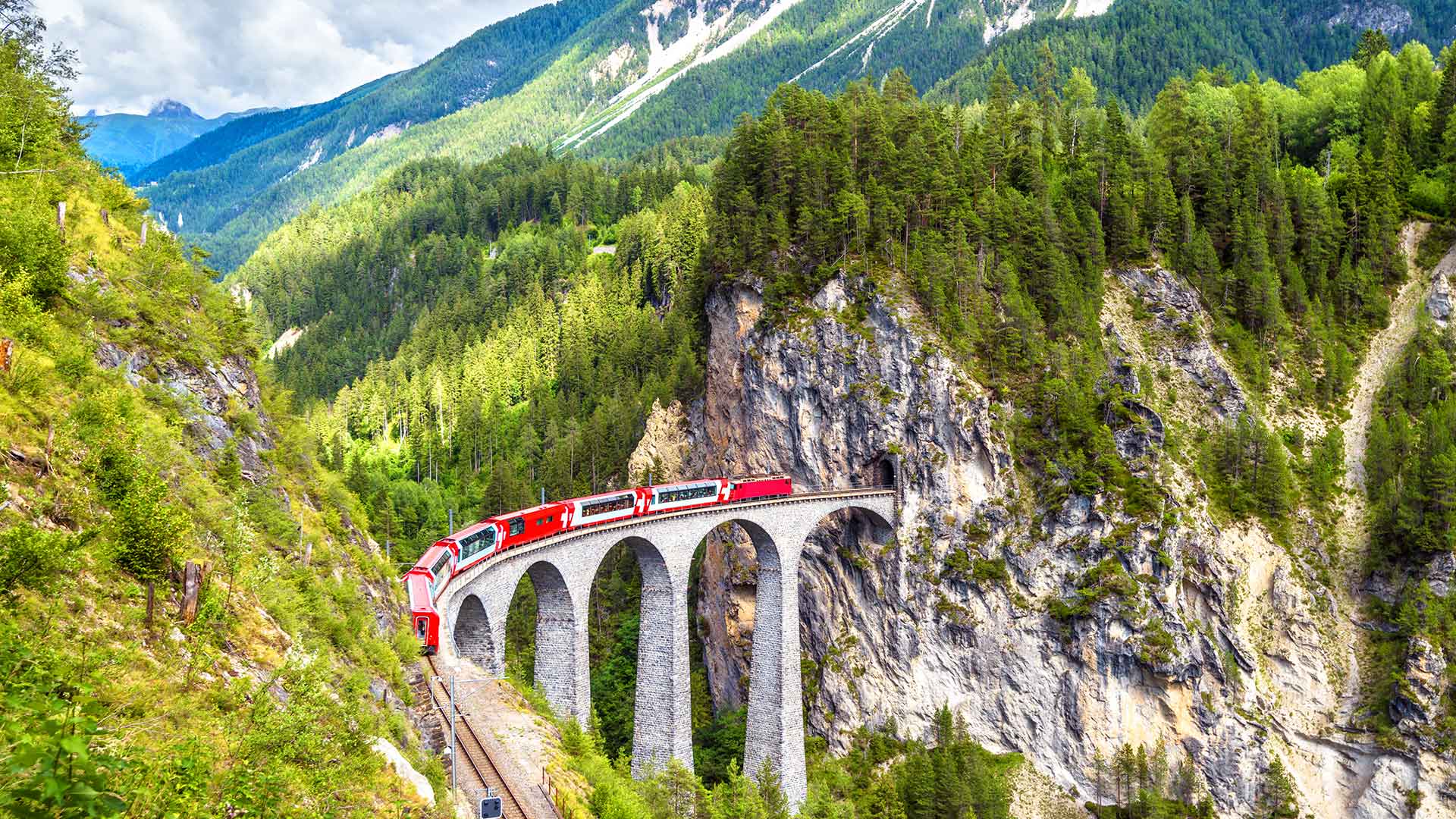 Glacier Express train crossing the Landwasser Viaduct in Switzerland