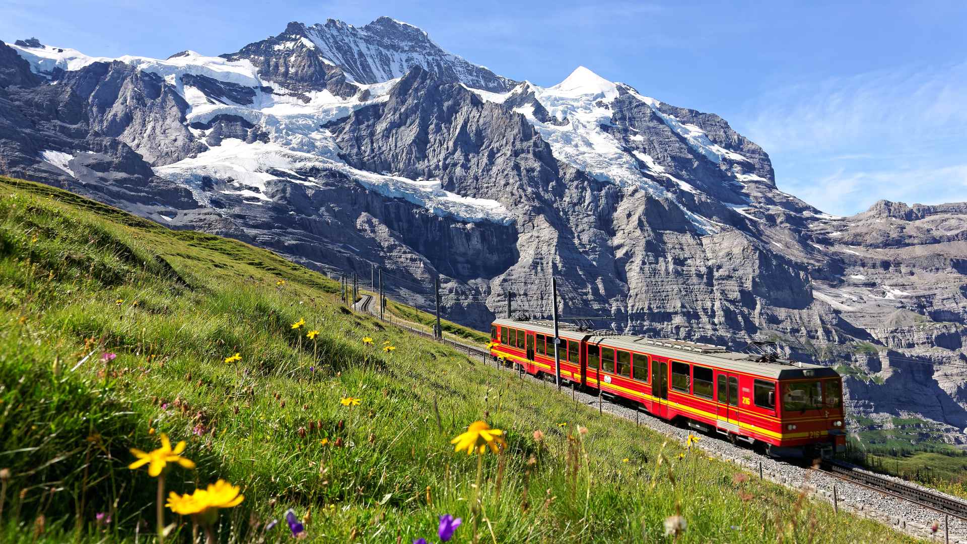 Jungfraujoch train with Jungfrau mountain in the background, Switzerland