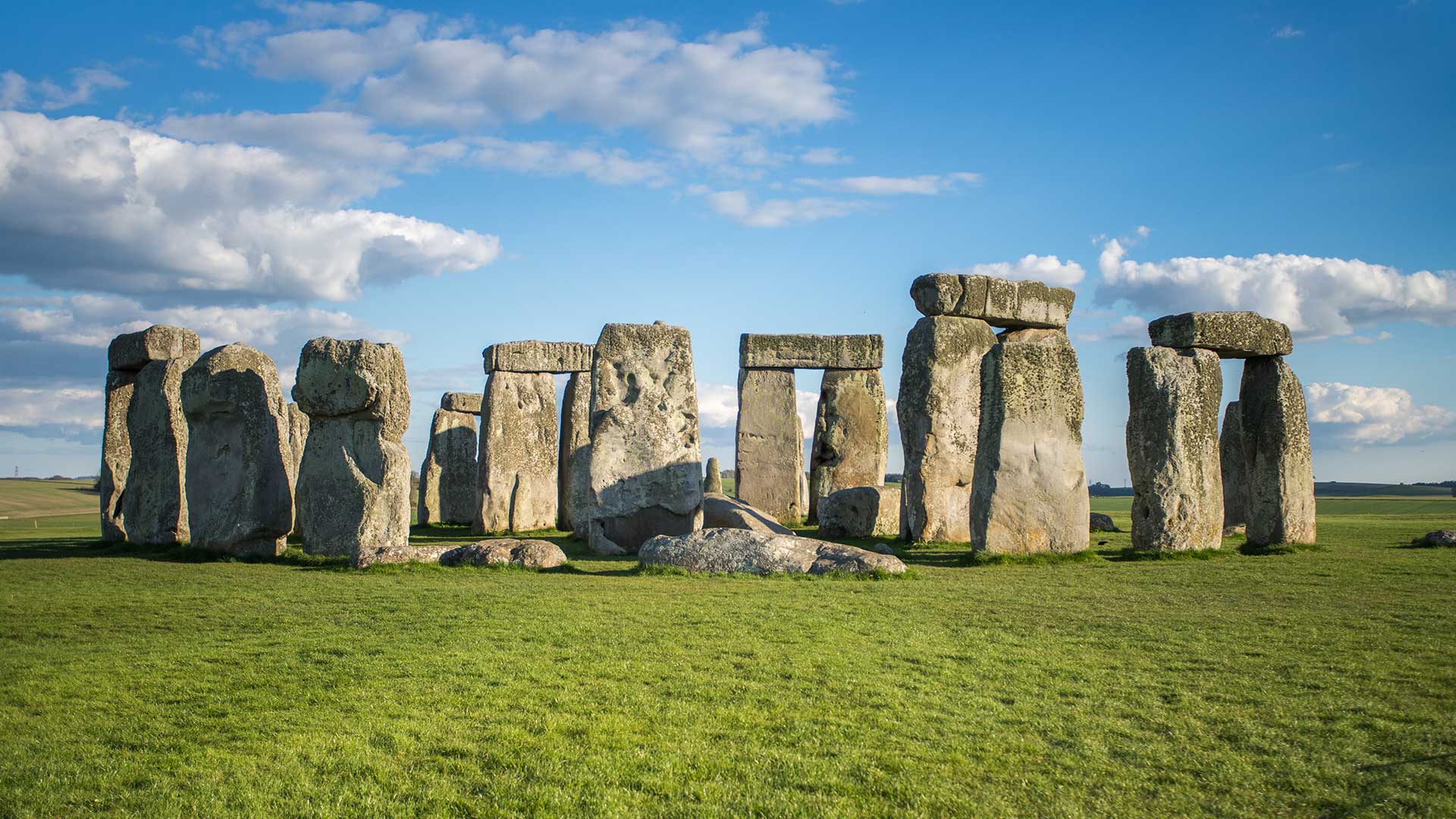 The imposing pillars of stonehenge standing on a sunny day