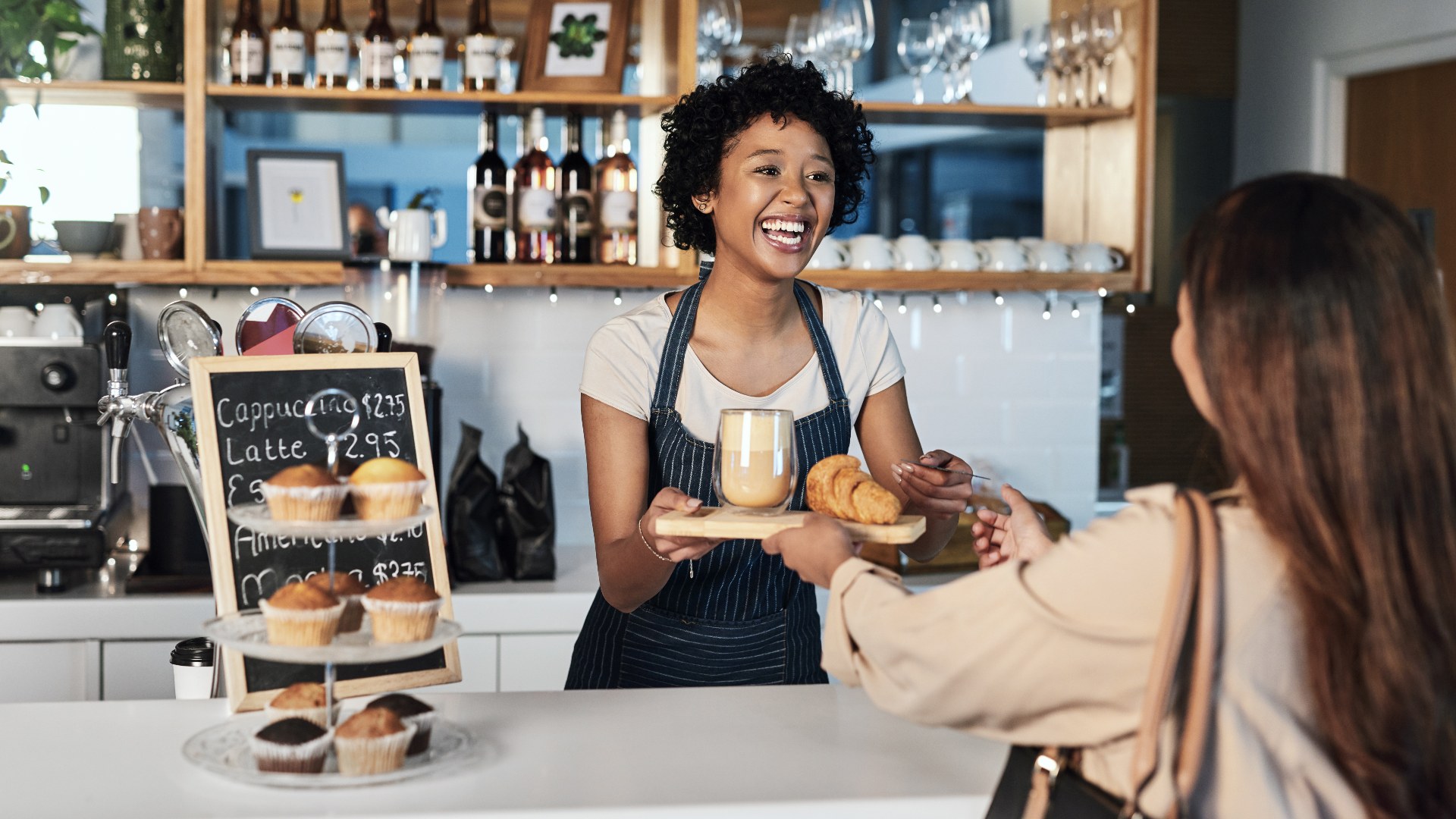 paying for a coffee at a quaint cafe in the uk