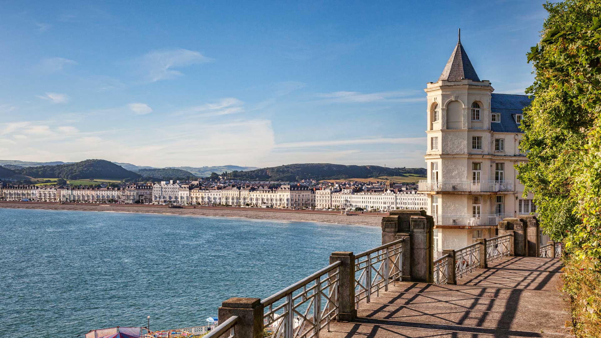 Llandudno promenade with blue waters and the Grand Hotel