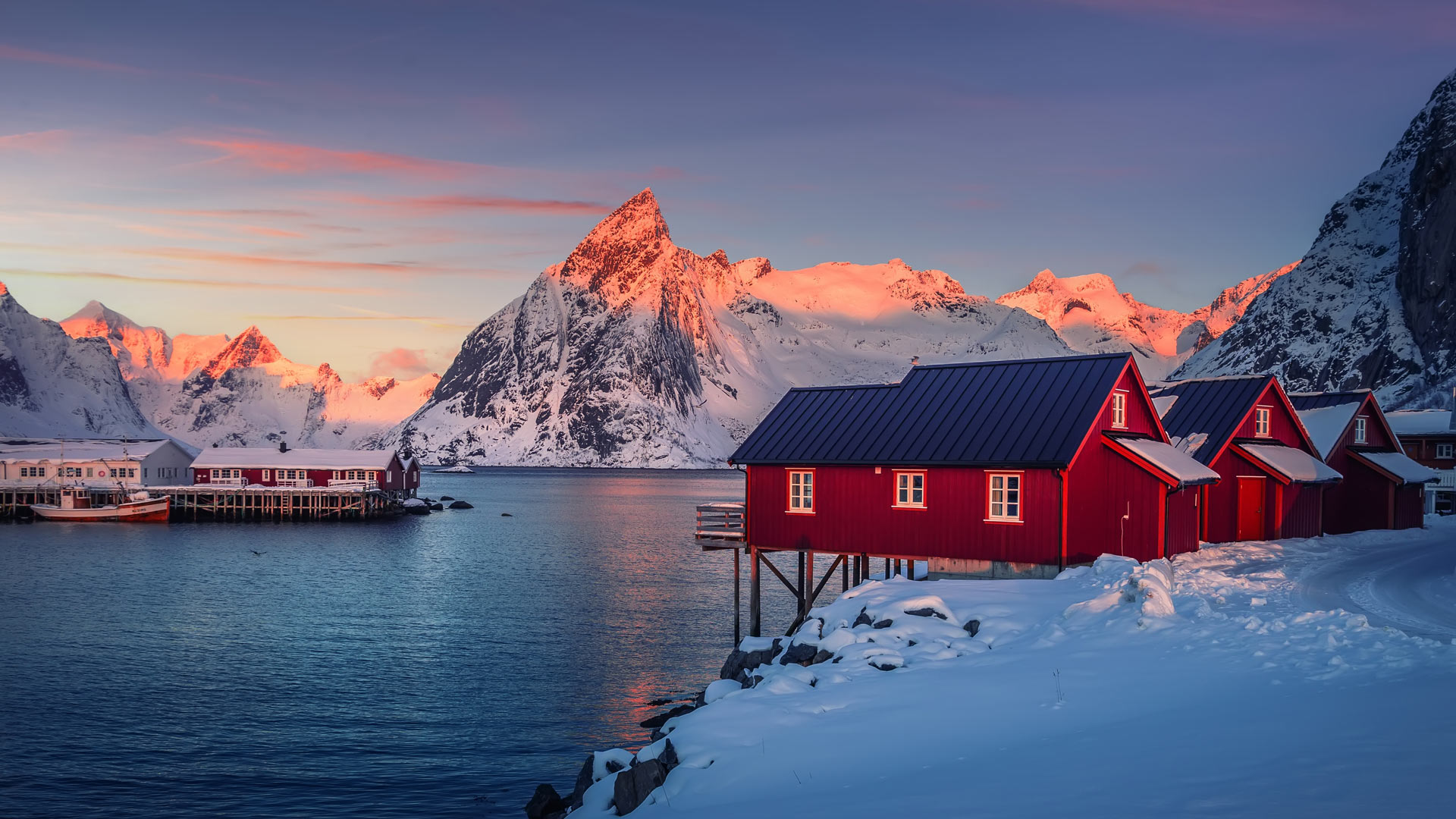 winter sunset fishing village reinefjord lofoten islands norway